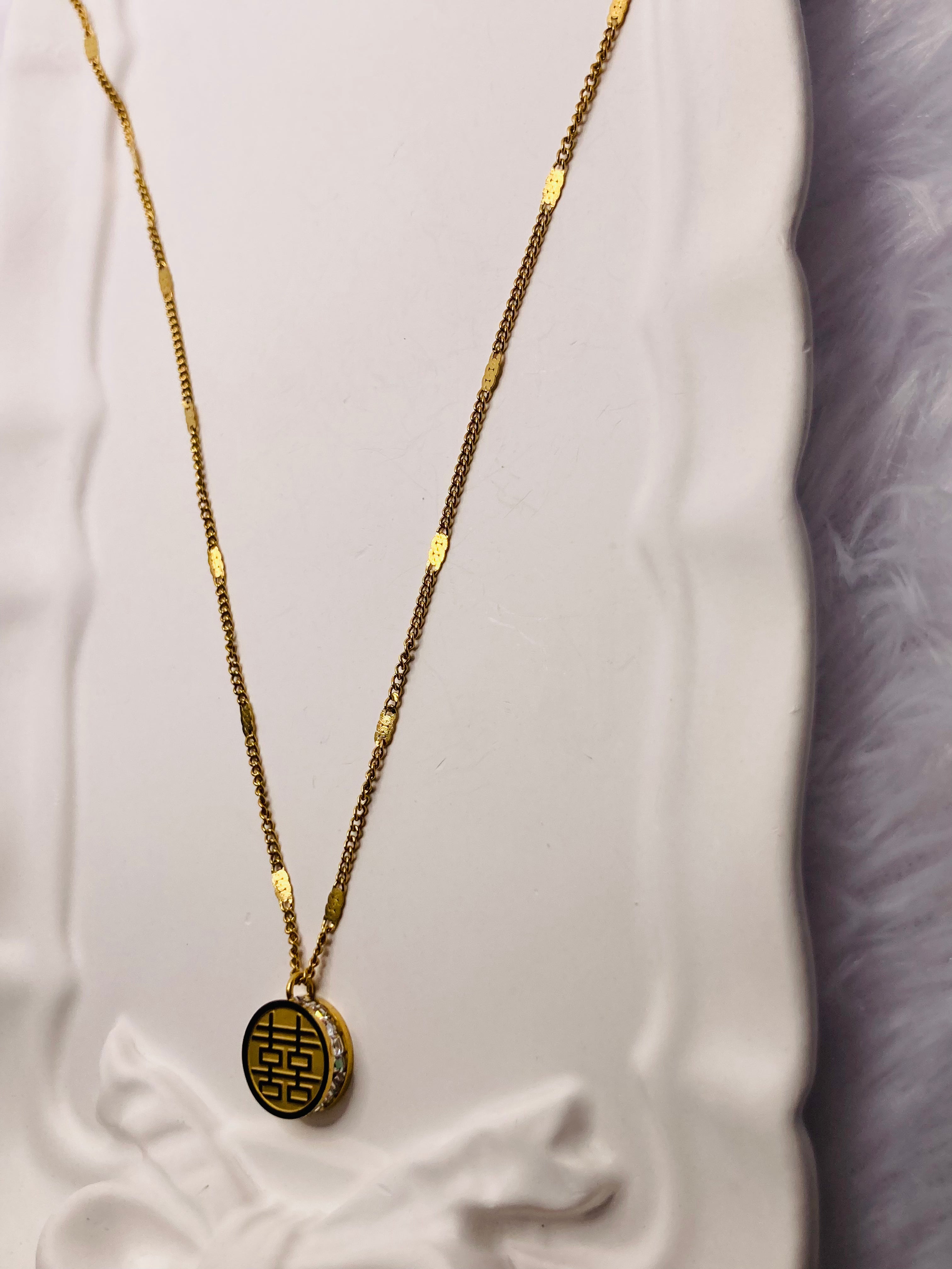 Diamond studded round charm necklace