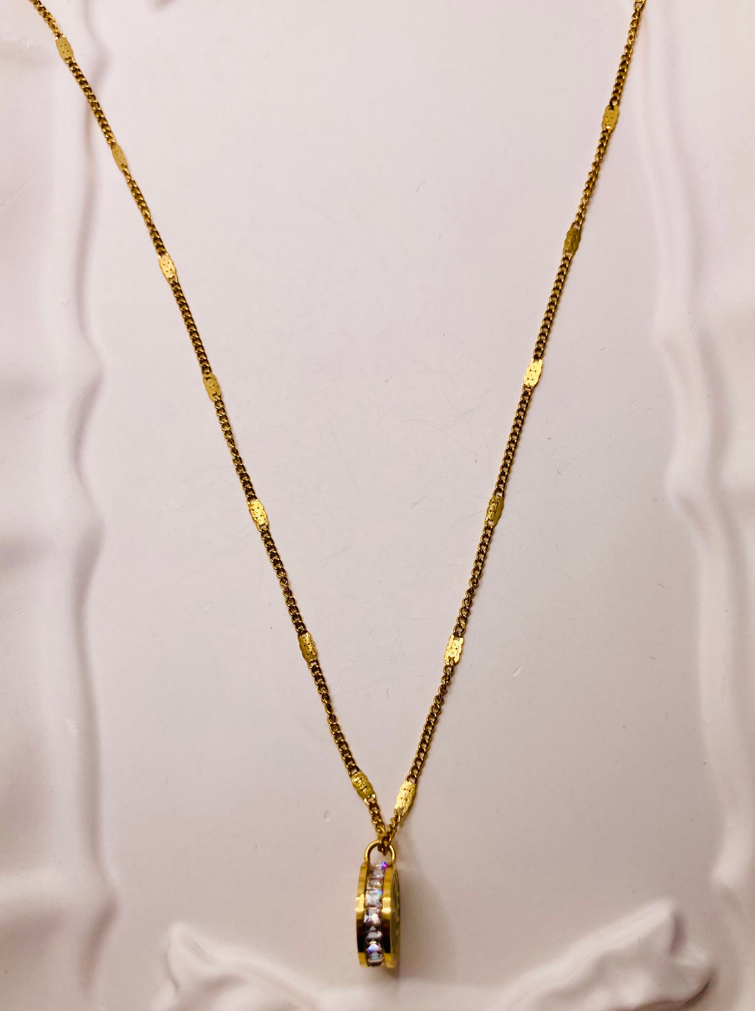 Diamond studded round charm necklace